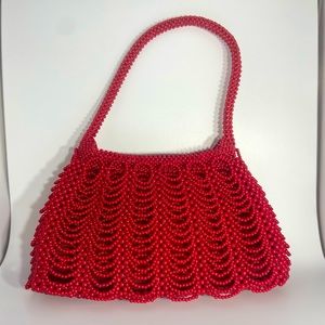 Red draped handbeaded handbag